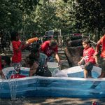 Children play with water guns and an inflatable pool in Brower Park, Crown Heights, on Friday July 22nd.